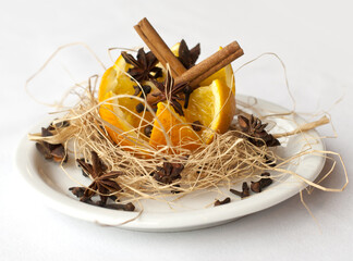 christmas decoration with cinnamon, orange and nuts