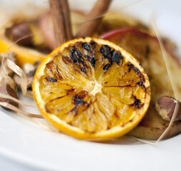 christmas decoration with cinnamon, orange and nuts