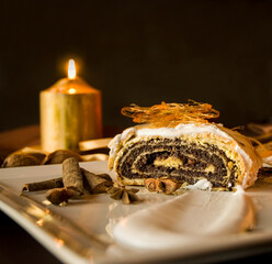 Christmas poppy seed cake on a plate with decoration
