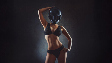 Fototapeta na wymiar Biker sexy mature woman in a motorcycle helmet. Outdoor lifestyle portrait