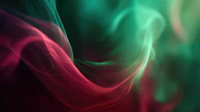Dynamic abstract art featuring flowing crimson and emerald smoke trails swirling gracefully against a dark background, creating a vibrant, ethereal display. - Powered by Adobe