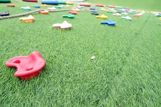 Bright Climbing Wall Mounts on Artificial Turf Playground Equipment Ground