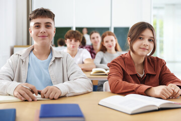 Teacher and students during lesson in classroom, selective focus