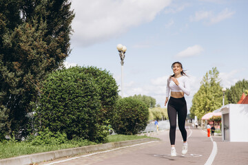 Athletic woman running outdoor for fitness and endurance