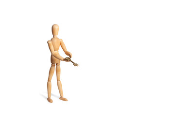 A wooden toy mannequin holding a key isolated on white background with copy space