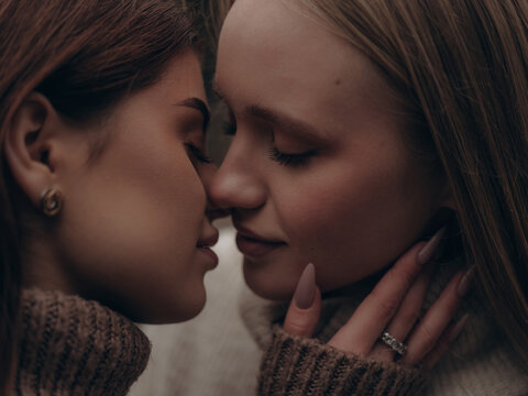 Extreme close-up beautiful kissing lesbian couple - Powered by Adobe