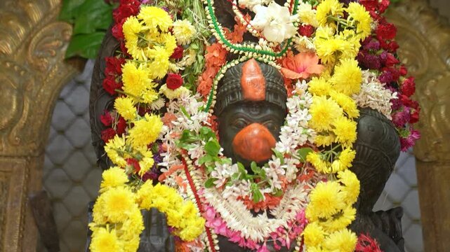 Closeup shot of Hindu god "Hanuman" Deity inside temple.
Worshipping Lord Hanuman.