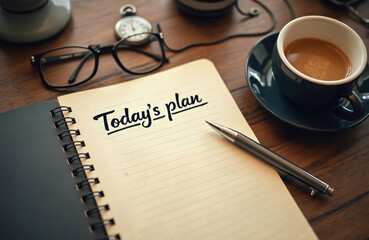 Notebook shows Today plan with pen, glasses, coffee cup, and pocket watch on wood table. Morning routine, day organization, business strategy planning.
