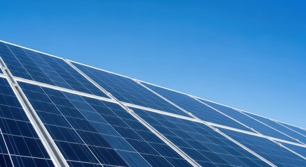 Solar panel array installed on rooftop under clear blue sky  