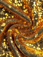 Shimmering gold sequins create a vibrant texture perfect for festive celebrations and glamorous events