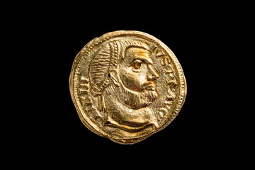 Gold Roman aureus coin replica of the Roman emperor Licinius AD308-AD 325 cut out and isolated on a...