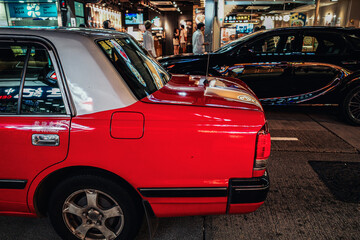 Red cab taxi in a street downtown in Central Hong Kong.