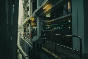 Hong Kong Star Ferry at the Tsim Sha Tsui station overlooking Victoria Harbour on a sunny day. Hong Kong