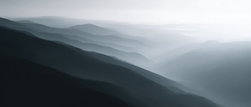mountain landscape with sunrise and misty valleys, top view, monochrome palette, premium look, soft diffused glow, minimal composition, generic props only - Powered by Adobe