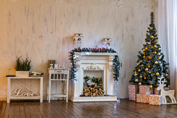 A fireplace with a christmas tree and presents on the mantle