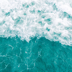 Turquoise olive green ocean wave during summer tide, abstract sea nature background