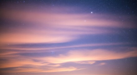Night sky with pink-hued clouds and visible stars