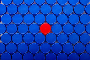 Large group of plastic bottles lined up on a table.