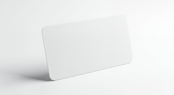 A blank white card standing on a white surface