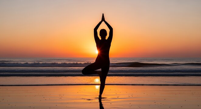 Silhouette of woman in tree pose at sunset beach - Powered by Adobe
