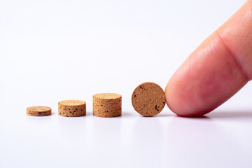 Growth Concept Finger Touching Increasing Cork Discs Progress Steps Development Level Up Business Plan Financial Strategy Achievement Goal