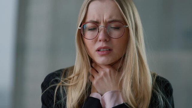 Bad feeling Caucasian business woman suffering throat pain ache breathing difficulty businesswoman ill female girl in office portrait holding neck feeling discomfort medicine trouble at work company
