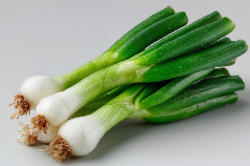 Fresh green onions arranged on a clean surface ready for cooking
