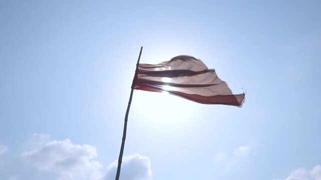 Temple flag waving in the wind. Hindu religion flag.