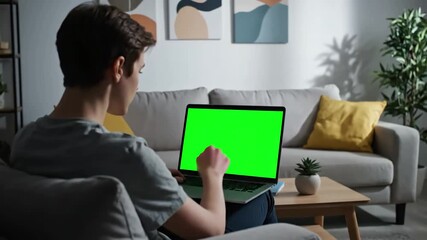 Green Screen young adult analyzing laptop display with in living room using mockup template isolated copy space and blank chrma key background on computer remote school student scene 3 distortion