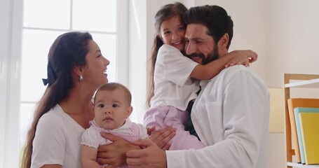 Family parents baby daughter home bonding together. Portrait of playful moment in a bright room as mom and dad hold kids, smiling in natural light. Love, care and happy family concept. - Powered by Adobe