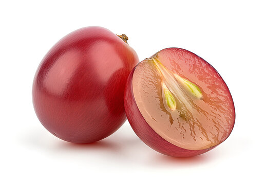 A whole red grape and a half of a red grape showing its juicy interior and seeds on a white background.