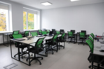 Computer science class with laptops at school