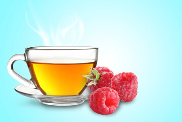 Hot beverage in cup and raspberries on turquoise background. Health boosting drink for cold season
