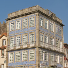 Fototapeta premium Neoclassical apartment building covered in blue azulejos tiles on a sunny day in Braga, Portugal 