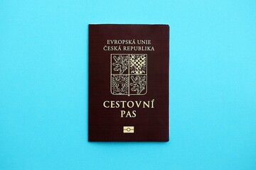 Czech biometrical passport on blue table background. Concept of citizenship of Czech Republic