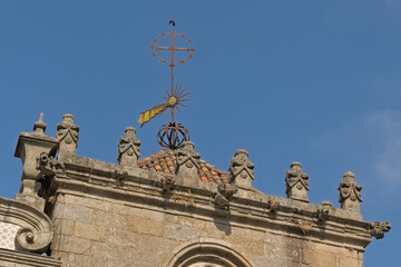 Obraz premium Roof with ornamental battlements and wind vane of Coimbros chapel in Braga, Portugal 