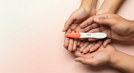 A couple gently holds a positive pregnancy test in their hands, sharing an intimate and hopeful moment together.