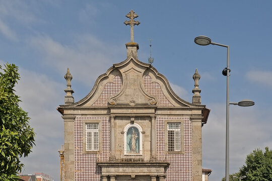 Detail pof the facade decorated with azulejos tiles of the Nossa Senhora-a-branca church in Braga, Portugal 