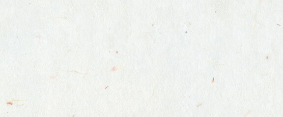 White handmade paper with subtle fiber textures and small colorful flecks. Organic and recycled...