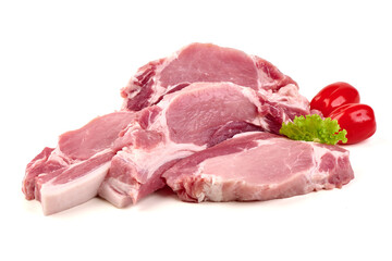 Several cuts of raw pork loin with red peppers and lettuce, showing fat marbling, isolated on white background