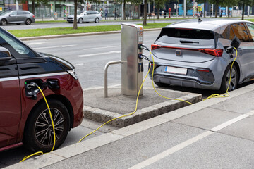 Austria. Vienna. Electric cars are charging at the station.