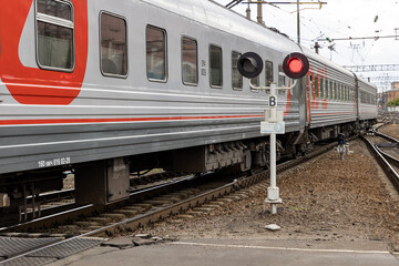 Russia. Voronezh. A passenger train passes by a semaphore.