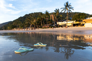Thailand. Koh Chang. Beach slippers by the sea.