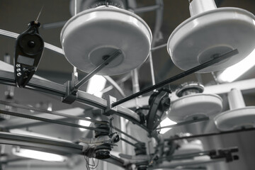 Industrial robotic arms meticulously inspect and sort circular products on a high-speed production...