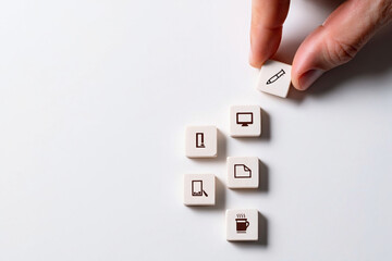 Hand Arranging White Tiles With Black Icons Writing Computer Document Smartphone Coffee Cup Icon Communication Concept 150