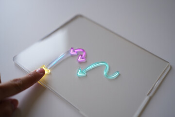 Human Finger Sliding on Touch Screen Tablet Device with Arrow Symbol Digital Interface Interactive Technology Direction Concept