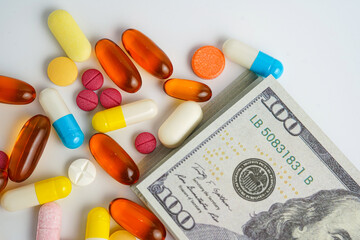 Medicine prescription drugs cost concept, Pills on money dollars, healthcare expenses