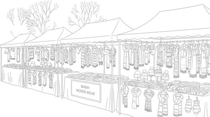 Outdoor market stall selling knitted scarves hats and gloves in black and white