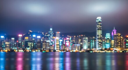 City lights bokeh across urban skyline at night