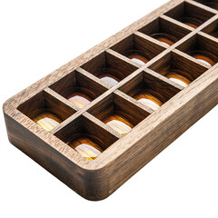 Antique Wooden Box with Amber Liquid Samples in Grid Compartments Studio Shot